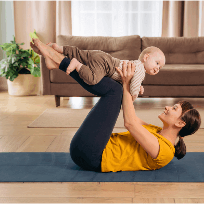 mum doing exercise carrying a baby